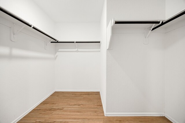 4347 Palmetto Grove Ln, Baytown, TX 77521 - spacious closet featuring wood finished floors