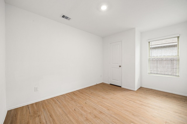 4347 Palmetto Grove Ln, Baytown, TX 77521 - spare room featuring light wood finished floors and baseboards