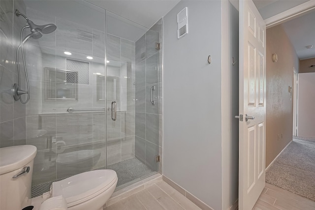 1881 Bering Dr Unit 27, Houston, TX 77057 - bathroom with toilet, a shower stall, and baseboards