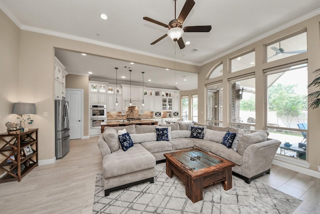 18910 Winding Atwood Ln, Tomball, TX 77377 - living room featuring a ceiling fan, ornamental molding, recessed lighting, and baseboards