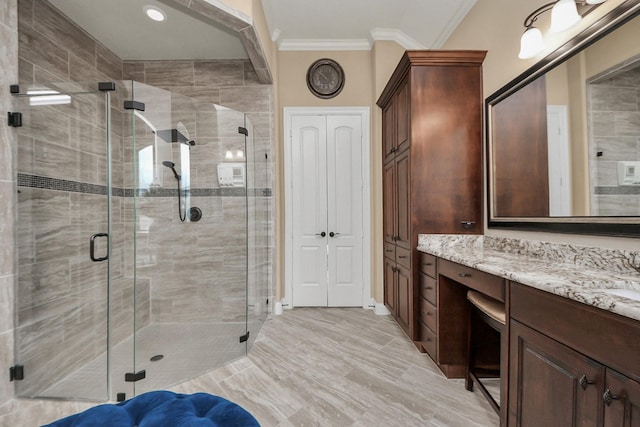 18910 Winding Atwood Ln, Tomball, TX 77377 - bathroom featuring ornamental molding, vanity, and a shower stall