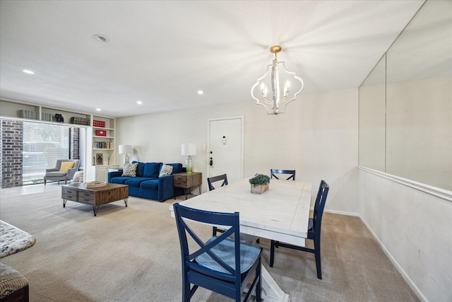 7575 Katy Fwy Unit 17, Houston, TX 77024 - carpeted dining space featuring recessed lighting, a chandelier, and baseboards