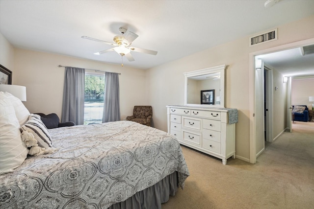 7575 Katy Fwy Unit 17, Houston, TX 77024 - bedroom with light carpet, a ceiling fan, and baseboards