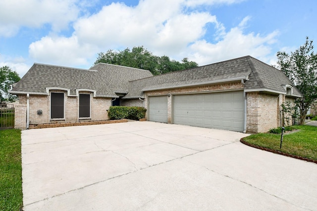2808 Cypress Point Dr, Missouri City, TX 77459 - view of front of property featuring roof with shingles, brick siding, a garage, and concrete driveway