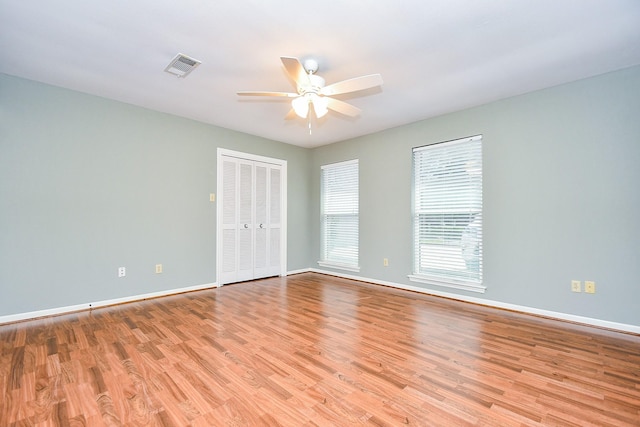 2808 Cypress Point Dr, Missouri City, TX 77459 - unfurnished room featuring ceiling fan, light wood-style floors, and baseboards