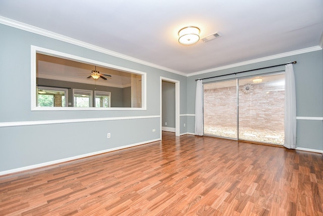 2808 Cypress Point Dr, Missouri City, TX 77459 - spare room featuring crown molding, wood finished floors, baseboards, and ceiling fan