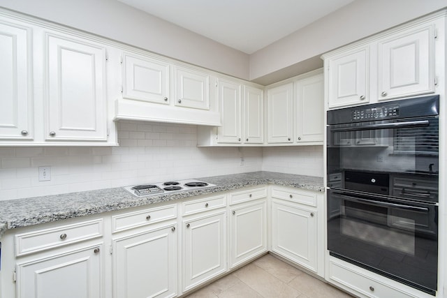 2808 Cypress Point Dr, Missouri City, TX 77459 - kitchen featuring electric stovetop, backsplash, white cabinets, and light stone countertops