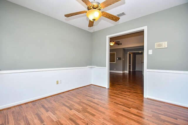 2808 Cypress Point Dr, Missouri City, TX 77459 - spare room with ceiling fan, wood finished floors, a wainscoted wall, and baseboards