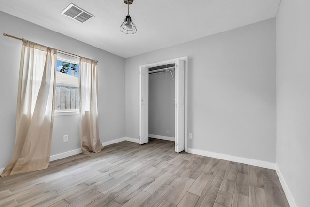 9802 Pale Star Dr, Houston, TX 77064 - unfurnished bedroom with light wood-style floors, baseboards, and a closet