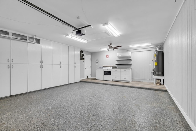 9802 Pale Star Dr, Houston, TX 77064 - garage featuring a garage door opener, electric water heater, and independent washer and dryer