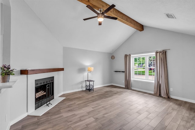 9802 Pale Star Dr, Houston, TX 77064 - unfurnished living room with a ceiling fan, wood finished floors, a fireplace with raised hearth, and baseboards