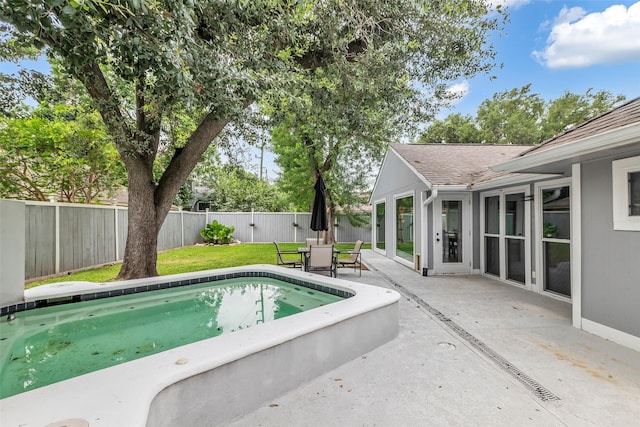 9802 Pale Star Dr, Houston, TX 77064 - view of swimming pool featuring a patio and a fenced backyard