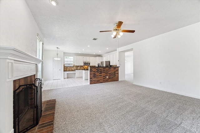 815 Spring Valley Ct, Sugar Land, TX 77479 - living area with a ceiling fan, light colored carpet, baseboards, a fireplace, and recessed lighting