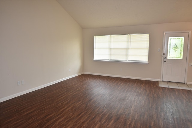 8115 Swan Meadow Ln, Humble, TX 77338 - entryway featuring vaulted ceiling, dark wood finished floors, and baseboards