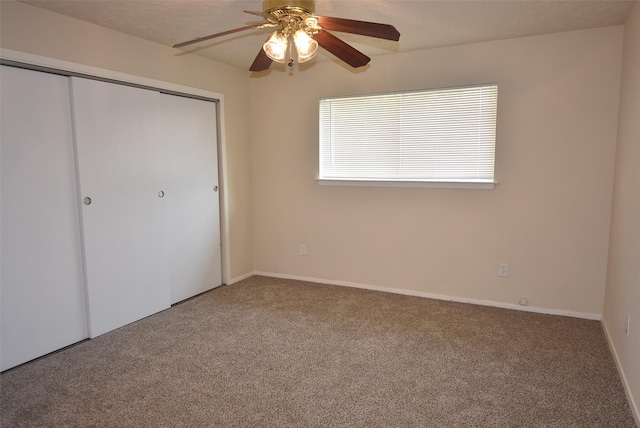 8115 Swan Meadow Ln, Humble, TX 77338 - unfurnished bedroom featuring carpet floors, a closet, a ceiling fan, and baseboards