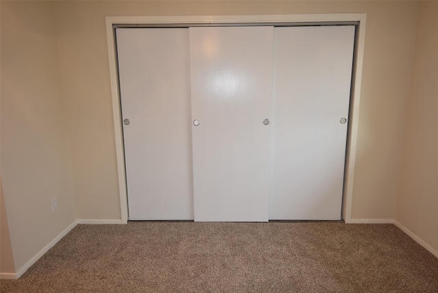 8115 Swan Meadow Ln, Humble, TX 77338 - unfurnished bedroom with carpet floors, baseboards, and a closet