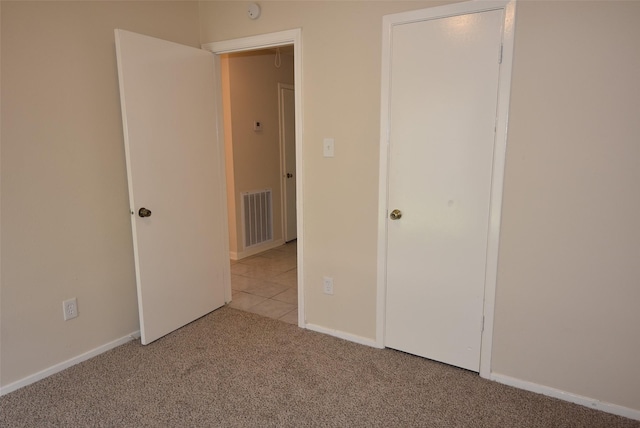 8115 Swan Meadow Ln, Humble, TX 77338 - unfurnished bedroom featuring carpet flooring and baseboards