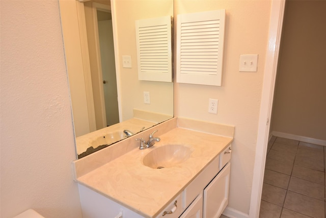 8115 Swan Meadow Ln, Humble, TX 77338 - bathroom with tile patterned flooring, vanity, and baseboards
