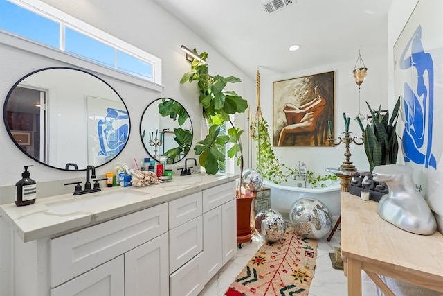 2719 Alabama St, Houston, TX 77004 - bathroom with double vanity, a soaking tub, marble look tile flooring, and recessed lighting
