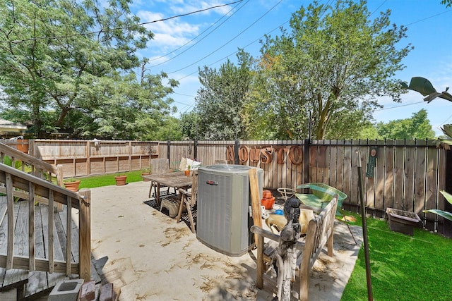 2719 Alabama St, Houston, TX 77004 - fenced backyard featuring cooling unit, outdoor dining space, and a patio