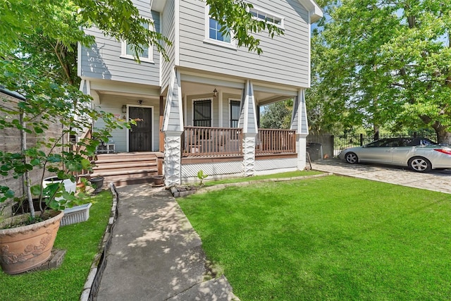 2719 Alabama St, Houston, TX 77004 - view of front facade with a porch and a front lawn