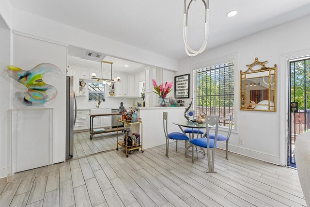 2719 Alabama St, Houston, TX 77004 - dining room featuring light wood-style floors, recessed lighting, and baseboards