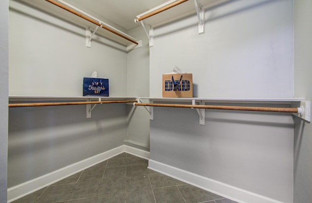 10523 Fawnview Dr, Houston, TX 77070 - spacious closet with dark tile patterned floors