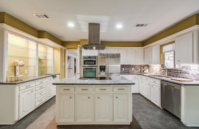 10523 Fawnview Dr, Houston, TX 77070 - kitchen with stainless steel appliances, a sink, island exhaust hood, a center island, and white cabinetry