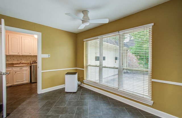 10523 Fawnview Dr, Houston, TX 77070 - unfurnished dining area featuring plenty of natural light, a ceiling fan, a sink, and baseboards