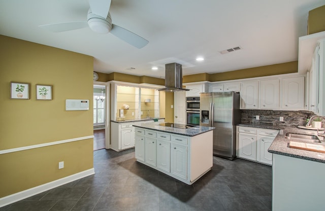 10523 Fawnview Dr, Houston, TX 77070 - kitchen with appliances with stainless steel finishes, a sink, island range hood, ceiling fan, and white cabinetry