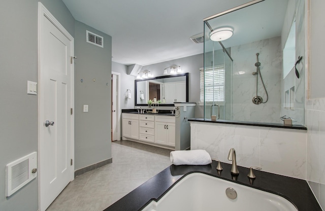 10523 Fawnview Dr, Houston, TX 77070 - bathroom with a stall shower, vanity, and a tub