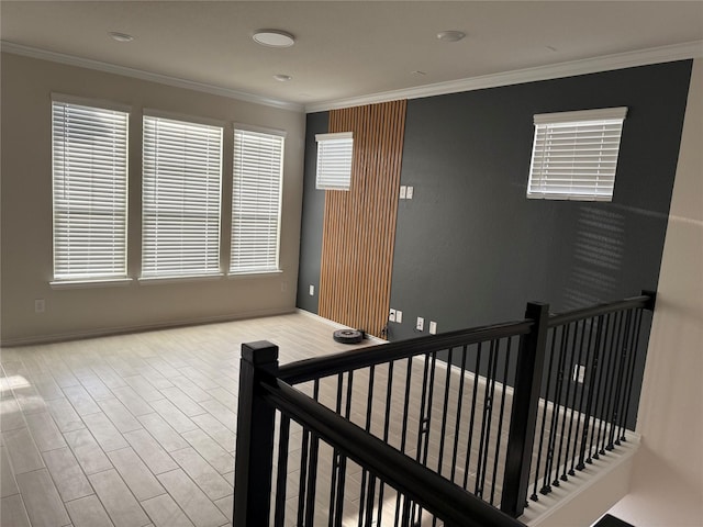 10307 Harmon Smith Dr, Houston, TX 77025 - empty room featuring healthy amount of natural light, crown molding, and wood finished floors