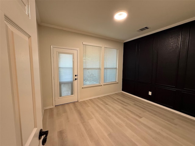 10307 Harmon Smith Dr, Houston, TX 77025 - interior space with ornamental molding and light wood-type flooring