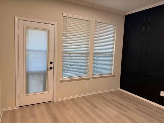 10307 Harmon Smith Dr, Houston, TX 77025 - entryway with light wood-style floors and crown molding