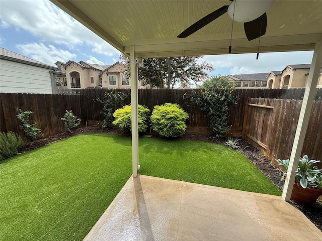 10307 Harmon Smith Dr, Houston, TX 77025 - fenced backyard featuring a patio area and a ceiling fan