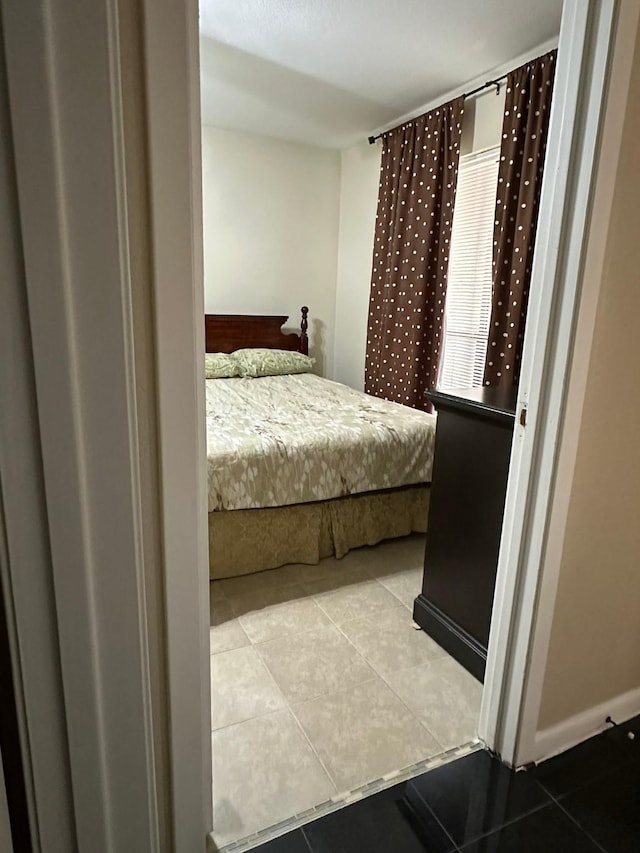 8100 Cambridge St Unit 30, Houston, TX 77054 - bedroom with tile patterned floors