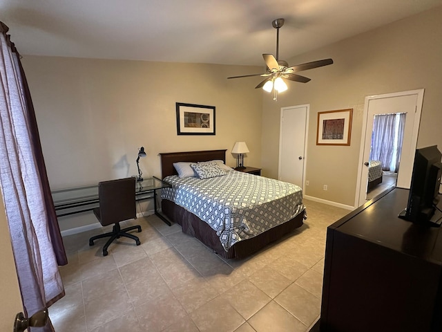 8100 Cambridge St Unit 30, Houston, TX 77054 - bedroom featuring light tile patterned floors, baseboards, lofted ceiling, and a ceiling fan