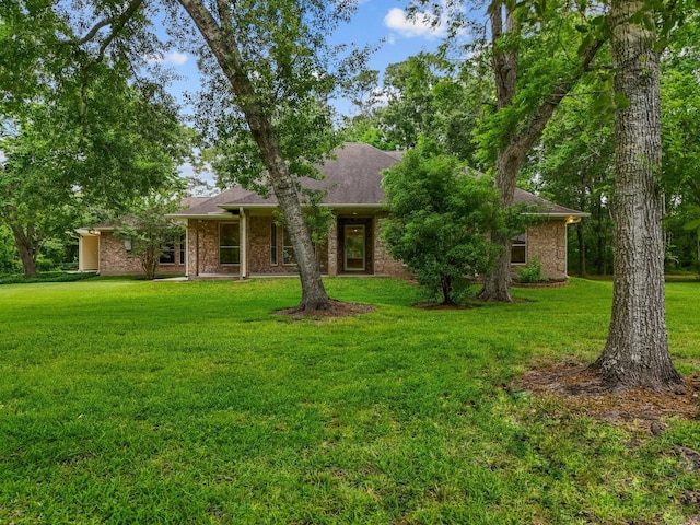 5401 Palm Dr, Dickinson, TX 77539 - view of front of property with a front lawn and brick siding