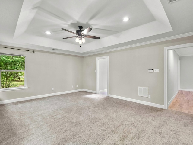 5401 Palm Dr, Dickinson, TX 77539 - spare room with a raised ceiling, a ceiling fan, carpet, ornamental molding, and recessed lighting