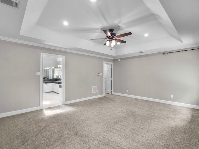 5401 Palm Dr, Dickinson, TX 77539 - spare room featuring a raised ceiling, ceiling fan, recessed lighting, light carpet, and ornamental molding