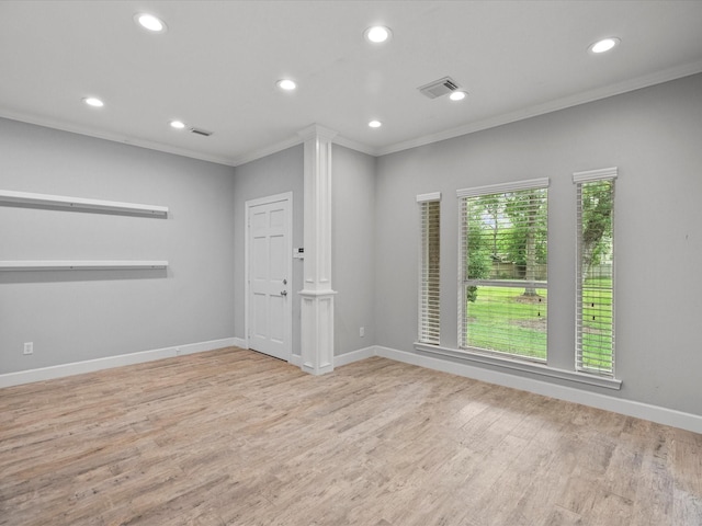 5401 Palm Dr, Dickinson, TX 77539 - unfurnished room featuring ornamental molding, recessed lighting, wood finished floors, baseboards, and ornate columns