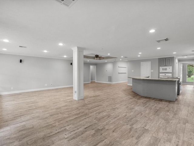 5401 Palm Dr, Dickinson, TX 77539 - unfurnished living room with light wood-style flooring, recessed lighting, baseboards, ceiling fan, and ornamental molding