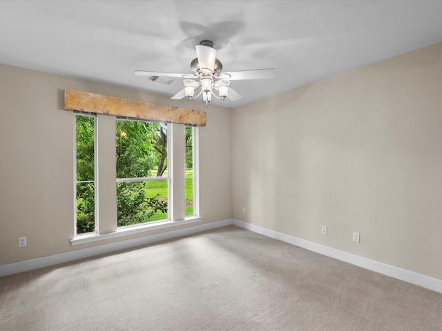 5401 Palm Dr, Dickinson, TX 77539 - carpeted spare room with baseboards and a ceiling fan