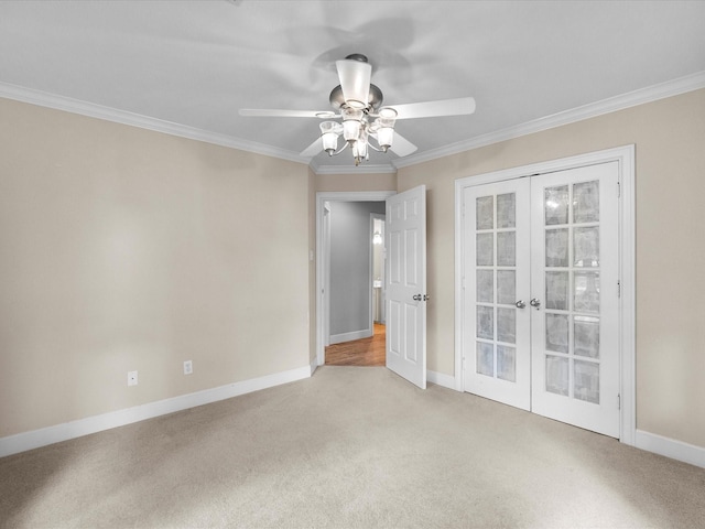 5401 Palm Dr, Dickinson, TX 77539 - unfurnished room with french doors, light carpet, ornamental molding, a ceiling fan, and baseboards