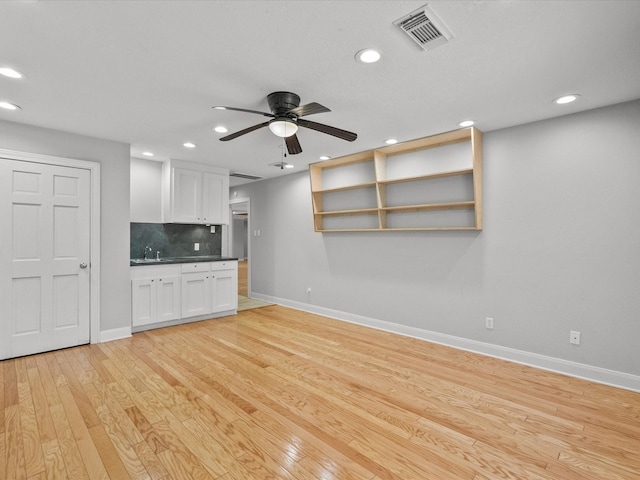 5401 Palm Dr, Dickinson, TX 77539 - unfurnished living room featuring baseboards, recessed lighting, ceiling fan, and light wood-type flooring