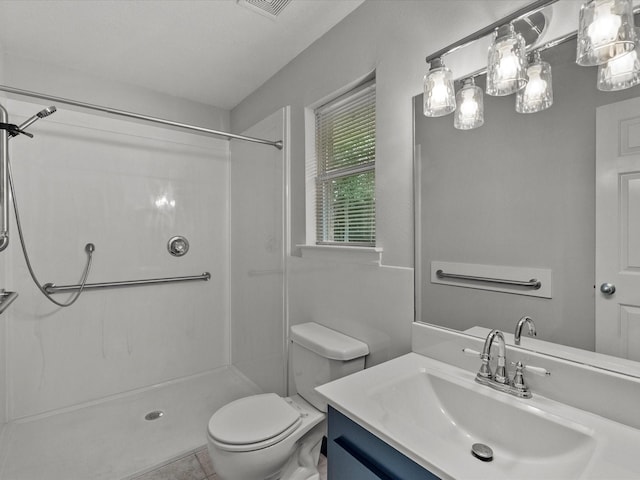5401 Palm Dr, Dickinson, TX 77539 - bathroom with a shower, toilet, vanity, and tile patterned flooring