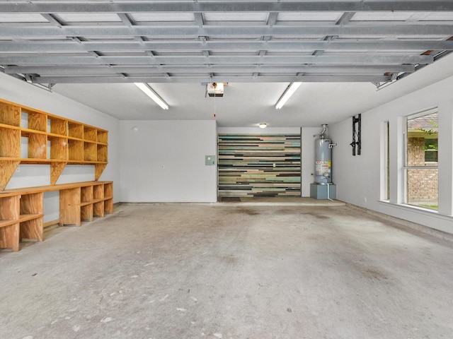 5401 Palm Dr, Dickinson, TX 77539 - garage featuring water heater and a garage door opener