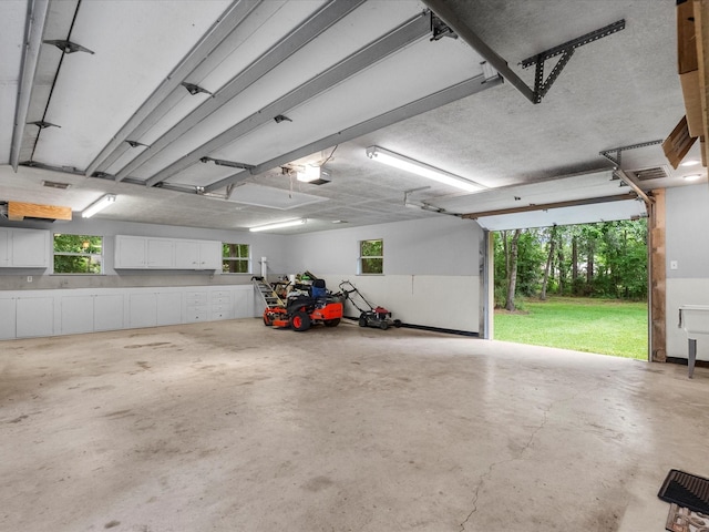 5401 Palm Dr, Dickinson, TX 77539 - garage featuring a garage door opener