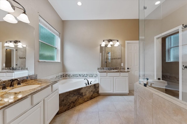 14102 Pollux Ct, Tomball, TX 77375 - bathroom with a garden tub, two vanities, tile patterned floors, and tiled shower