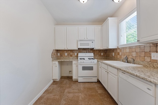 14102 Pollux Ct, Tomball, TX 77375 - kitchen with white appliances, a sink, backsplash, white cabinets, and baseboards